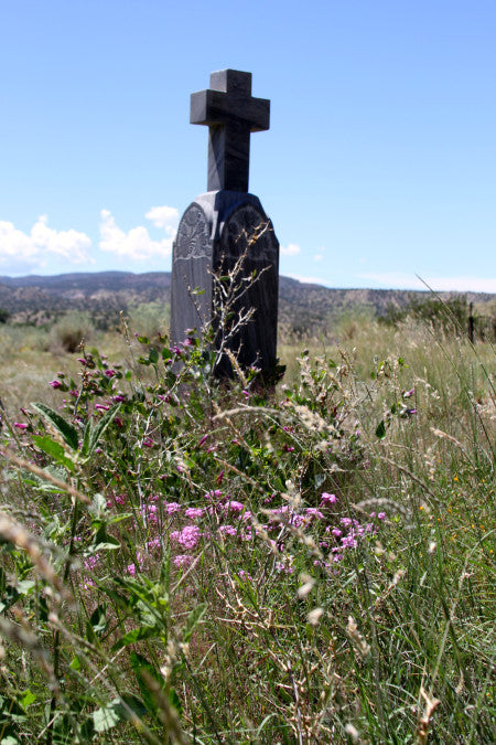 Cross Headstone in an open field